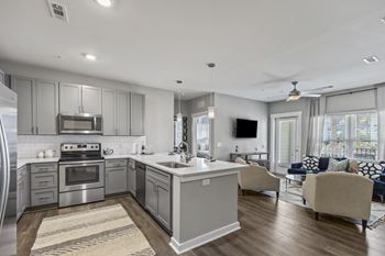 Kitchen with stainless steel appliances central island square, daniel island sc